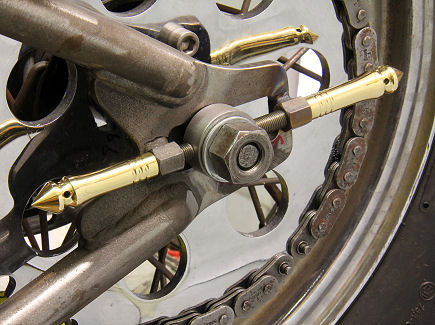 On our bikes with high torque motors and heavy brake loads, we use two adjusters per side to lock down the rear axle.