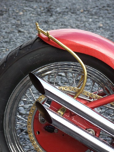 Upswept drags and hand formed solid brass fender support by DeVille Cycles.