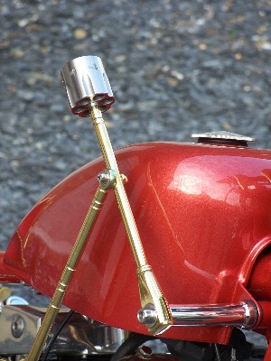 Brass hand shifter linkage with stainless steel 44 Magnum revolver cylinder.