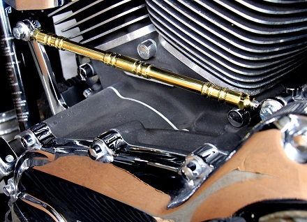 Solid brass shifter linkage with swivel BALL type rod ends installed on a Harley Softail.