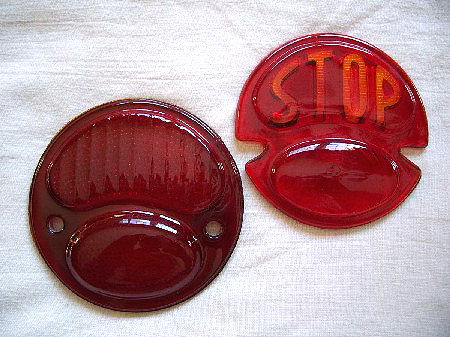 Model A tail light replacement glass lenses are available in your choice of either solid red or with STOP script.