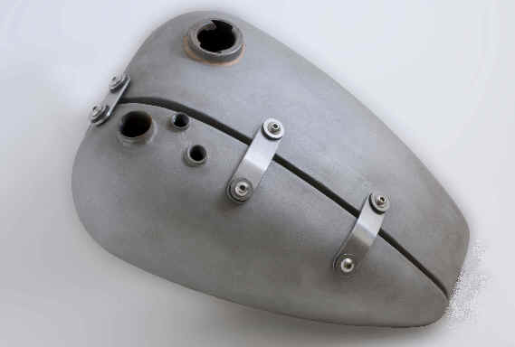 Split gas tank only from DeVille Cycles. Tanks have 3/8" NPT, 2-1/2" high tunnel. Finish is raw steel. 