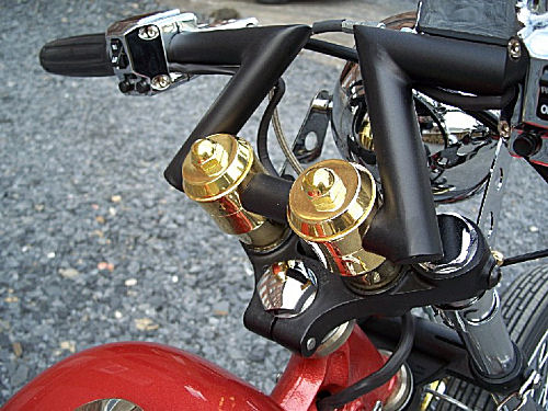 Model #1 custom glide style solid brass risers have a 2 inch rise and fit one inch diameter handlebars. Proudly made is USA.