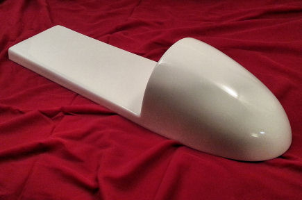 Lightweight hand laid fiberglass cafe tail with smooth white gel coat finish.