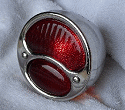 Model A tail lights with solid red lens.